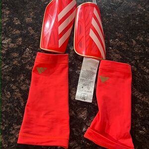 Orange and White Shin Guards for soccer